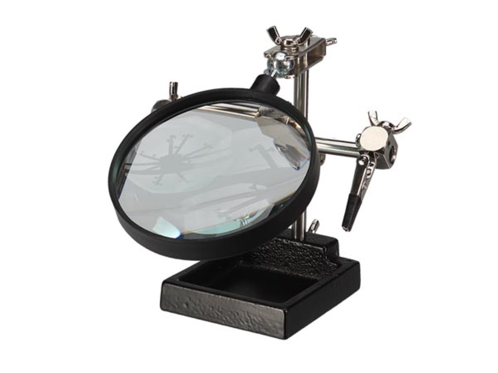 DERDE HAND MET VERGROOTGLAS afbeelding